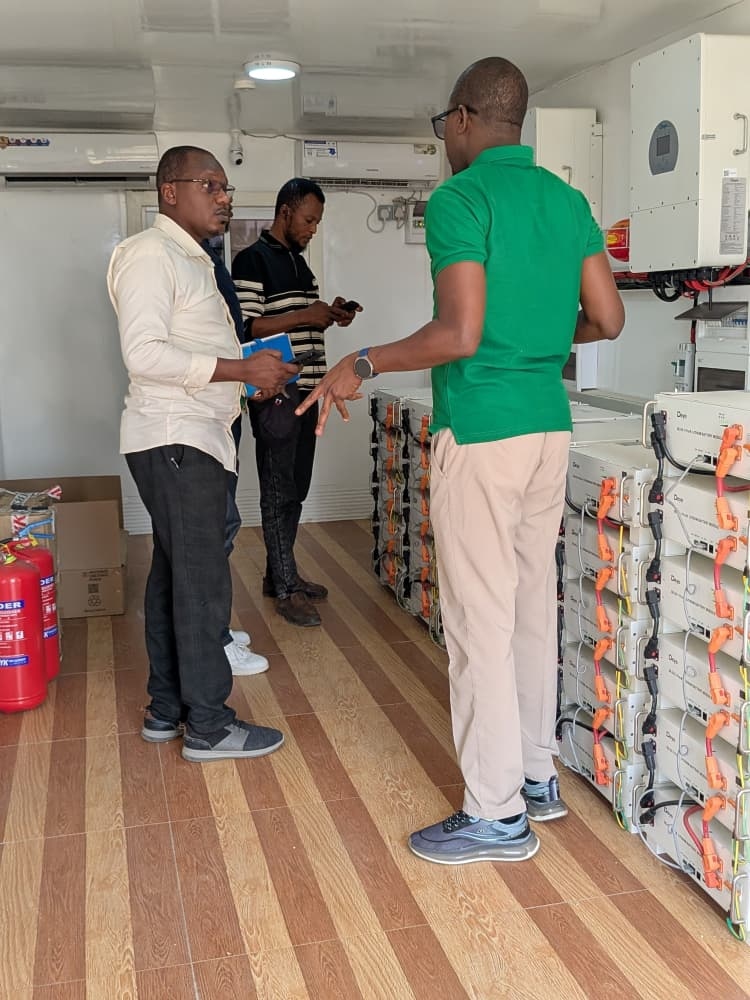 A A Nafada Solutions engineers commissioning commercial solar hybrid inverters and lithium battery energy storage systems